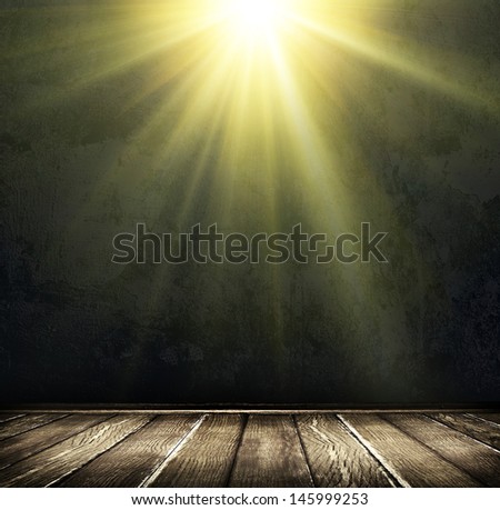 Light on wooden floor in empty room 