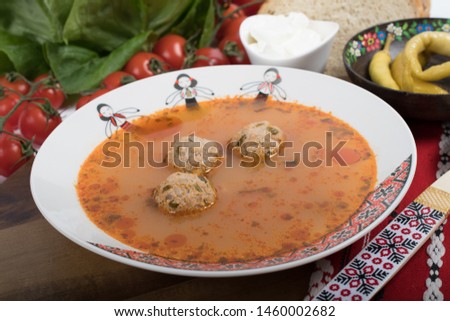 Top view of plate with meatballs soup, traditional plate of the Romanian cuisine, ciorba de perisoare