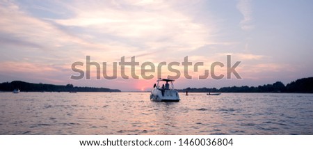 Yacht in a sunset with young people
