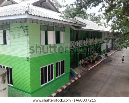 School building built with wood, renovated And painted to be beautiful, pleasant to learn Royalty-Free Stock Photo #1460037215