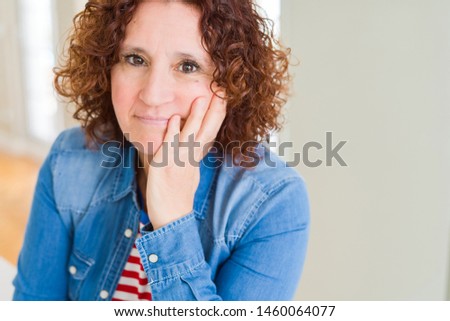 Beautiful senior woman thinking looking tired and bored with depression problems with crossed arms.