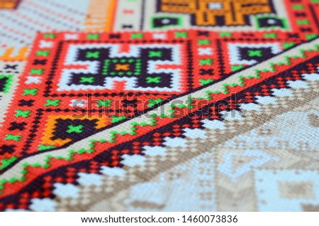 Traditional Ukrainian folk art knitted embroidery pattern on textile fabric