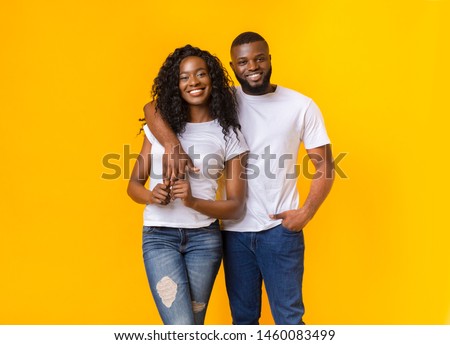 Beautiful Black Couple Is Cuddling On Yellow Background, free space