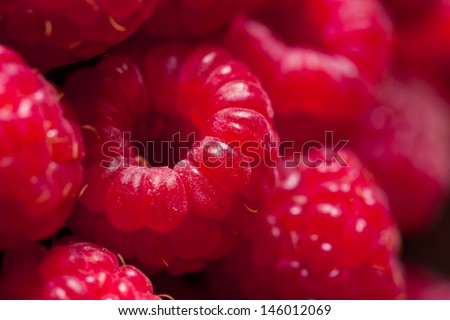 Fresh sweet raspberries close up. Royalty-Free Stock Photo #146012069