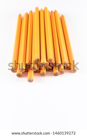 vertical photo of pencils in white