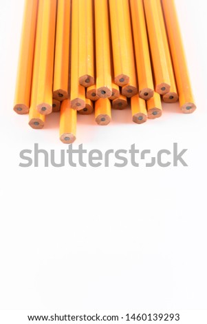 vertical photo of pencils in white background