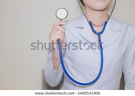 A nurse put a stethoscope to the heart itself, and ready to use.