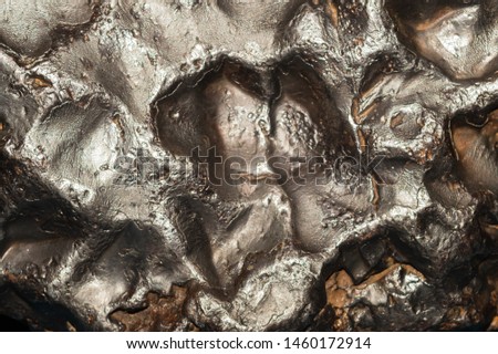 Meteorite texture background. meteorite surface close up. stone backdrop