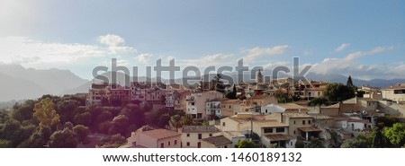 Aerial panoramic photo Campanet town hillside residential old ancient houses building exterior situated in the northeast of Majorca Island, Spain