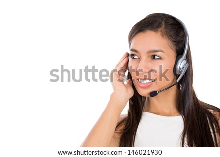 Close-up portrait of a smiling adorable customer representative talking on a phone, isolated on a white background 