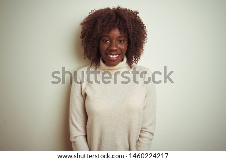 Young african afro woman wearing turtleneck sweater over isolated white background with a happy and cool smile on face. Lucky person.