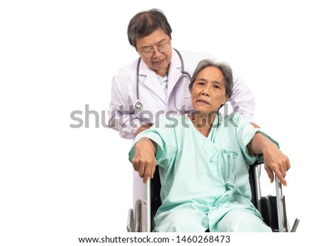 Asian elderly woman with a paralysis, stroke or cerebrovascular accident (CVA) symtoms sitting on wheelchair and the doctor take care. Elderly health care. Royalty-Free Stock Photo #1460268473