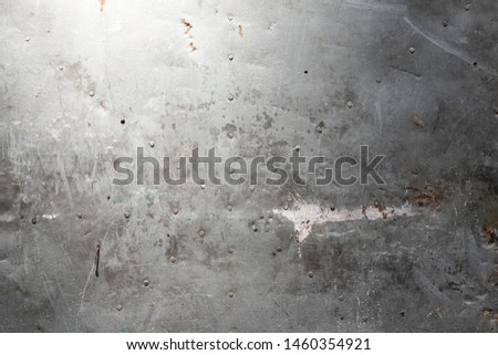 Metal texture with scratches and cracks. Cement wall dark edges textured background. Black painted wall texture background. Dark grunge textured wall closeup. Grunge Background