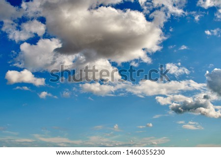 Blue sky with white clouds on a summer day, background