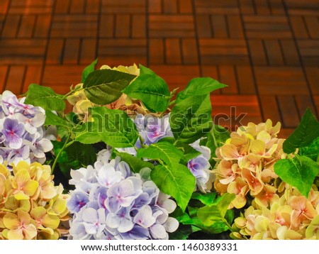 decorative flowers on the background of a wooden floor