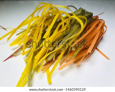 Buying conceptual Italian pasta string made of different alternative compositions of vegetables with pasta on white background.