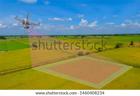 Smart farmer use drone for various fields. Drone for agriculture and use for various field. Drone copter flying with digital camera.Drone with high resolution digital camera.