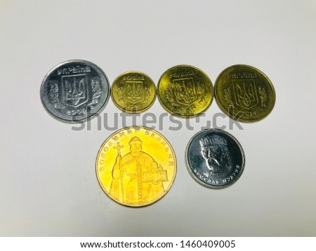 Conceptual Ukrainian money made from mixed coins of different alternate sequential compositions of metal coins of Ukraine on white background is Finance bank and the money Iron screen. 