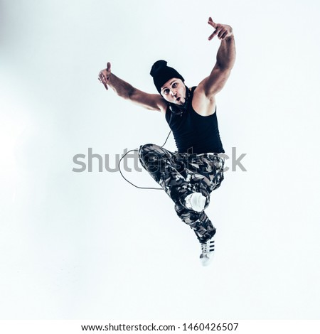young rapper dancing break dance .photo on a white background.