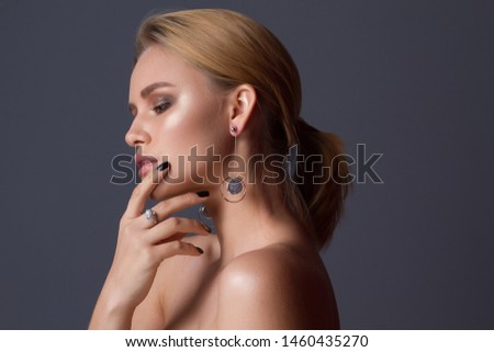 Young beautiful girl posing for jewerly collection . Royalty-Free Stock Photo #1460435270