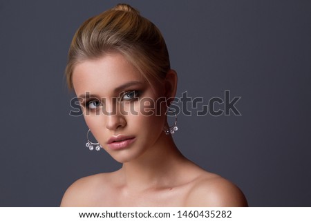 Young beautiful girl posing for jewerly collection . Royalty-Free Stock Photo #1460435282