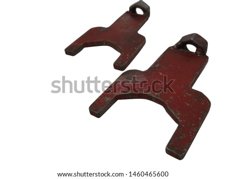 Red wrench, isolated on white background.