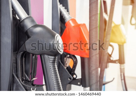 Petrol filling nozzles at gas station pump