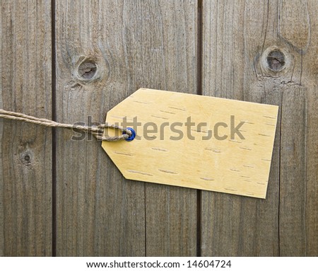 Blank Price Tag On Wooden Background