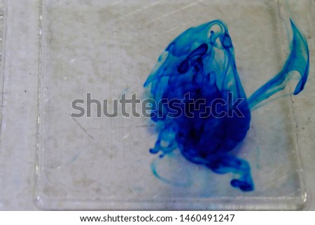 Abstract blue ink dragon in water