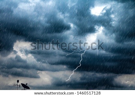 Lightning and thunderstorm flash with raining background. Bad weather and cloudy problem with aerial or satellite signal.