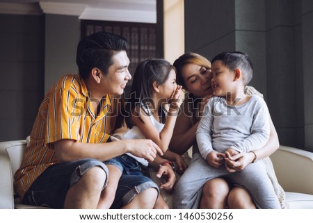 Happy family with kids spending time together at home
