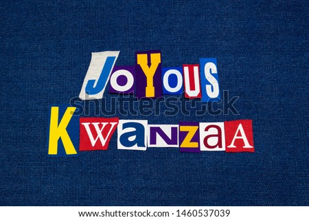JOYOUS KWANZAA word text collage typography, multi colored fabric on blue denim, African American holiday, horizontal aspect