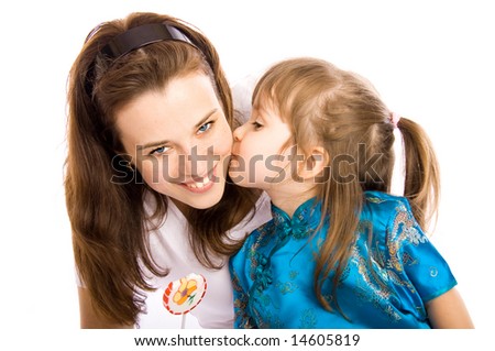 Lovely girl kissing her mother