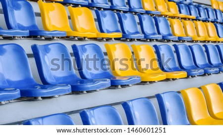 Close up of The Stadium seat colorful. Plastic seat rows at the Arena. Pattern texture of set chairs with empty. The Amphitheater. Sports.
