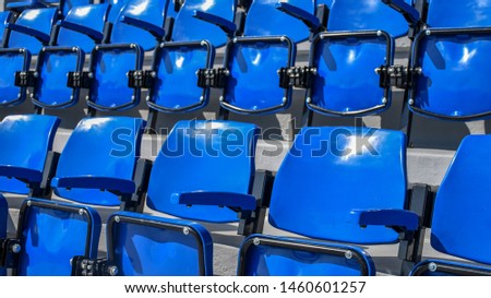 Close up to the Amphitheater. The chairs blue of empty plastic seat on out door The Stadium. Rows of Pattern texture wallpaper view. Sports. 