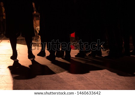 
people's feet on the stage of the theater during the opera. 18th century clothing. backstage Royalty-Free Stock Photo #1460633642