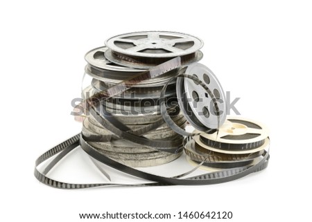 Film strip on metal reel isolated on white background