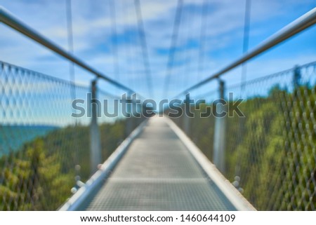 Blurred picture of a suspension bridge at town of "Bad Wildbad" in Black Forest in Germany