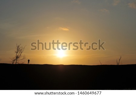 One person and The Scenery at Sunset 