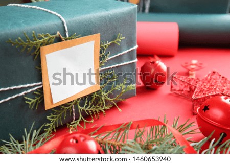 Beautiful Christmas gift box with decor on color background, closeup