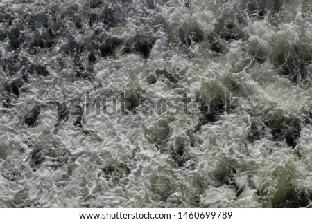 Foam with bubbles on the sea surface