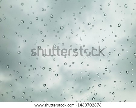 Raindrop on car window background
