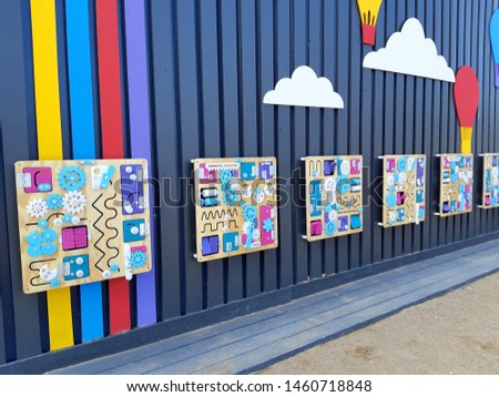 Playground wall for children with toys.  Empty playschool room with toys and furniture.