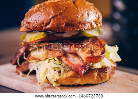 Hamburger on restaurant table, wooden