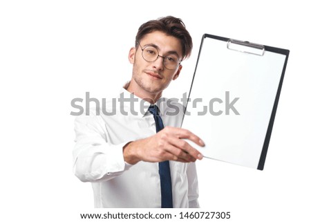 business man in glasses with tablet folder on an isolated background place free blank