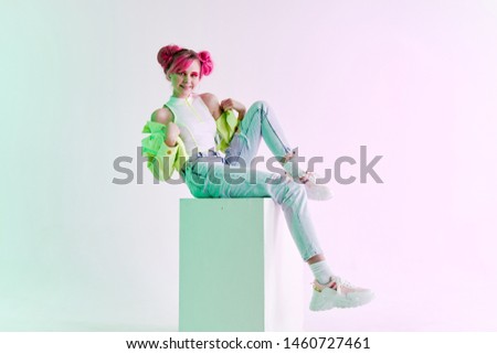 woman sitting on a cube retro fashion style