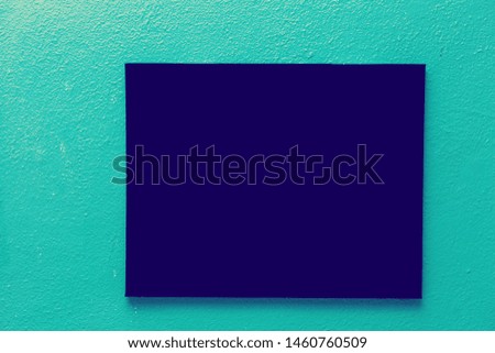 Empty picture frame on a bright solid background