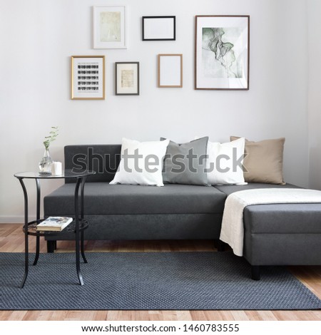 Contemporary living room with stylish gray corner sofa and round coffee table