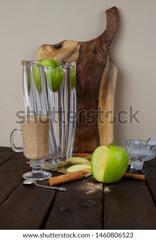 apple smoothie on a table in a glass