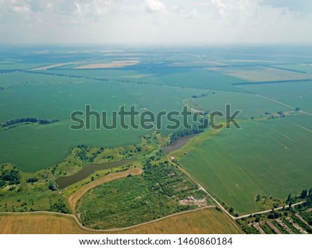 Aerial view. Rain over the fields and lakes